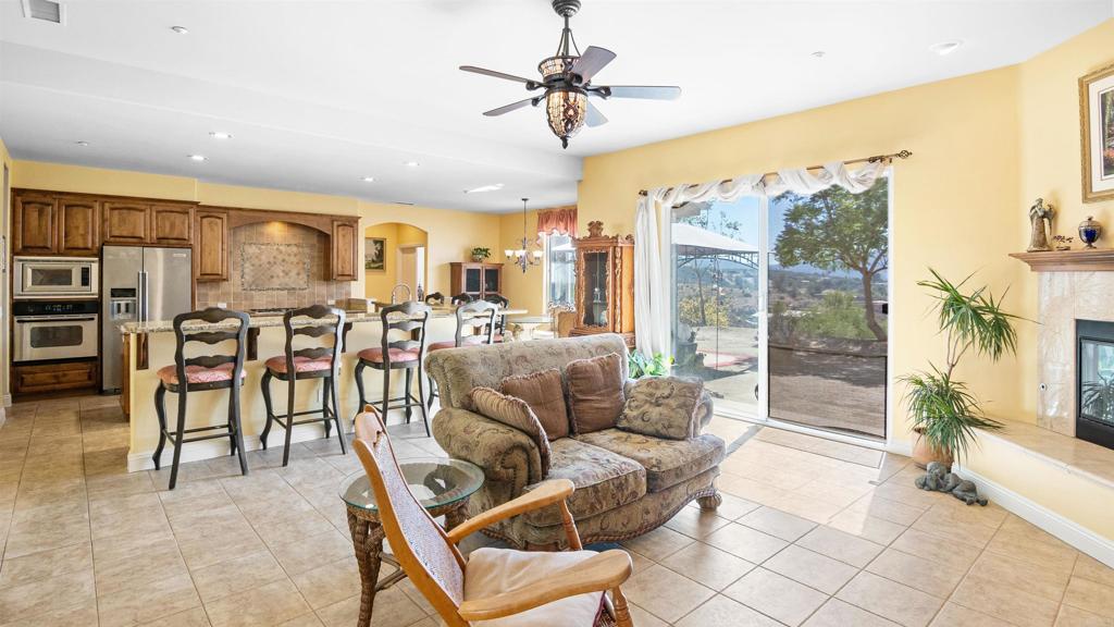 40487 Rock Mountain Drive Fallbrook, CA 92028 - Photo 5 of 57 a living room with furniture and kitchen view