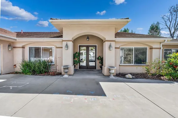 a view of a livingroom with furniture and a window