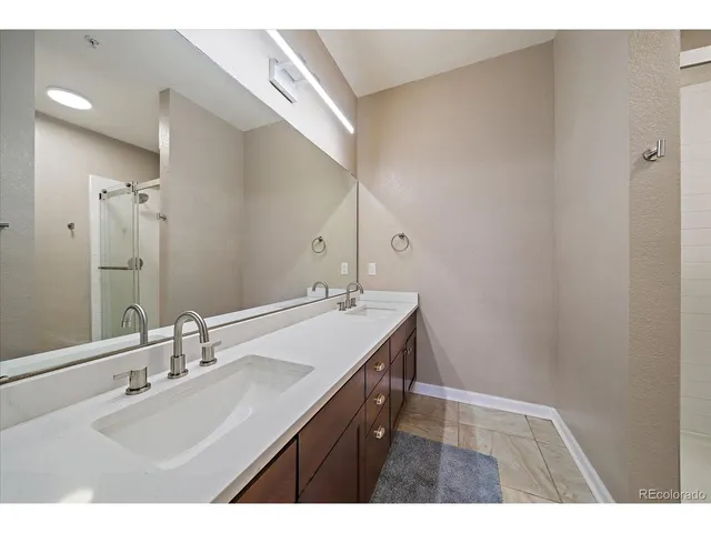 a bathroom with a shower and toilet