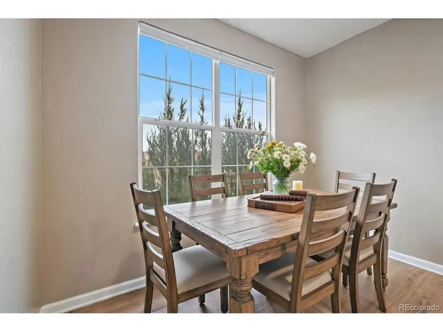 a view of a workspace with wooden floor