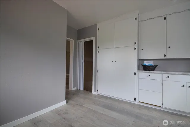a kitchen with a sink a counter top space and stainless steel appliances
