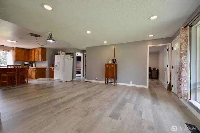 a view of a livingroom with furniture and a window