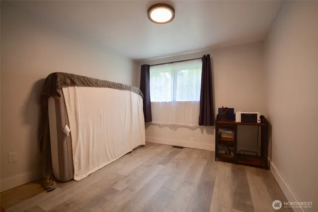 a bathroom with a bathtub a sink and a mirror