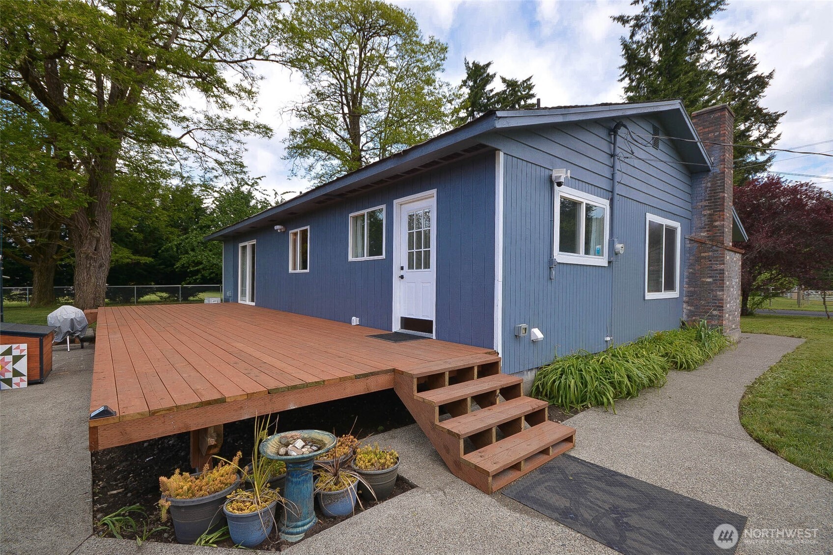 20005 Carper Road Southwest Rochester, WA 98579 - Photo 10 of 35 a view of a house with a patio and a yard