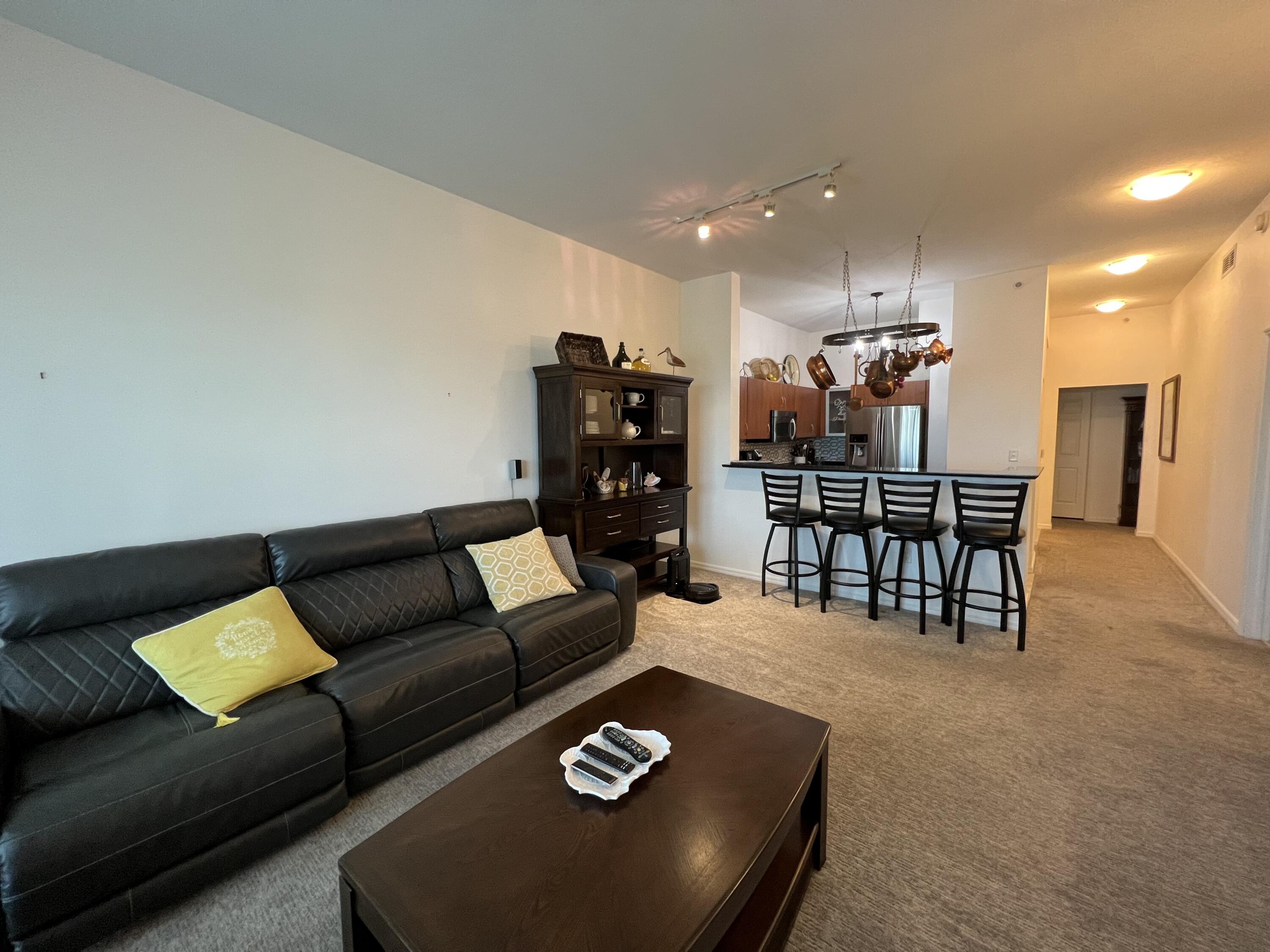 802 West Windward Way, Unit PH15 Lantana, FL 33462 - Photo 18 of 34 a living room with furniture