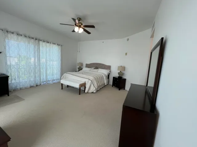 a bed room with a bed and a television