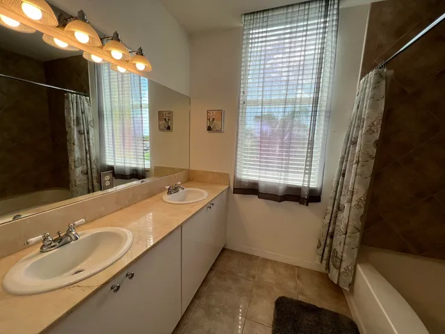 a bedroom with bed and window