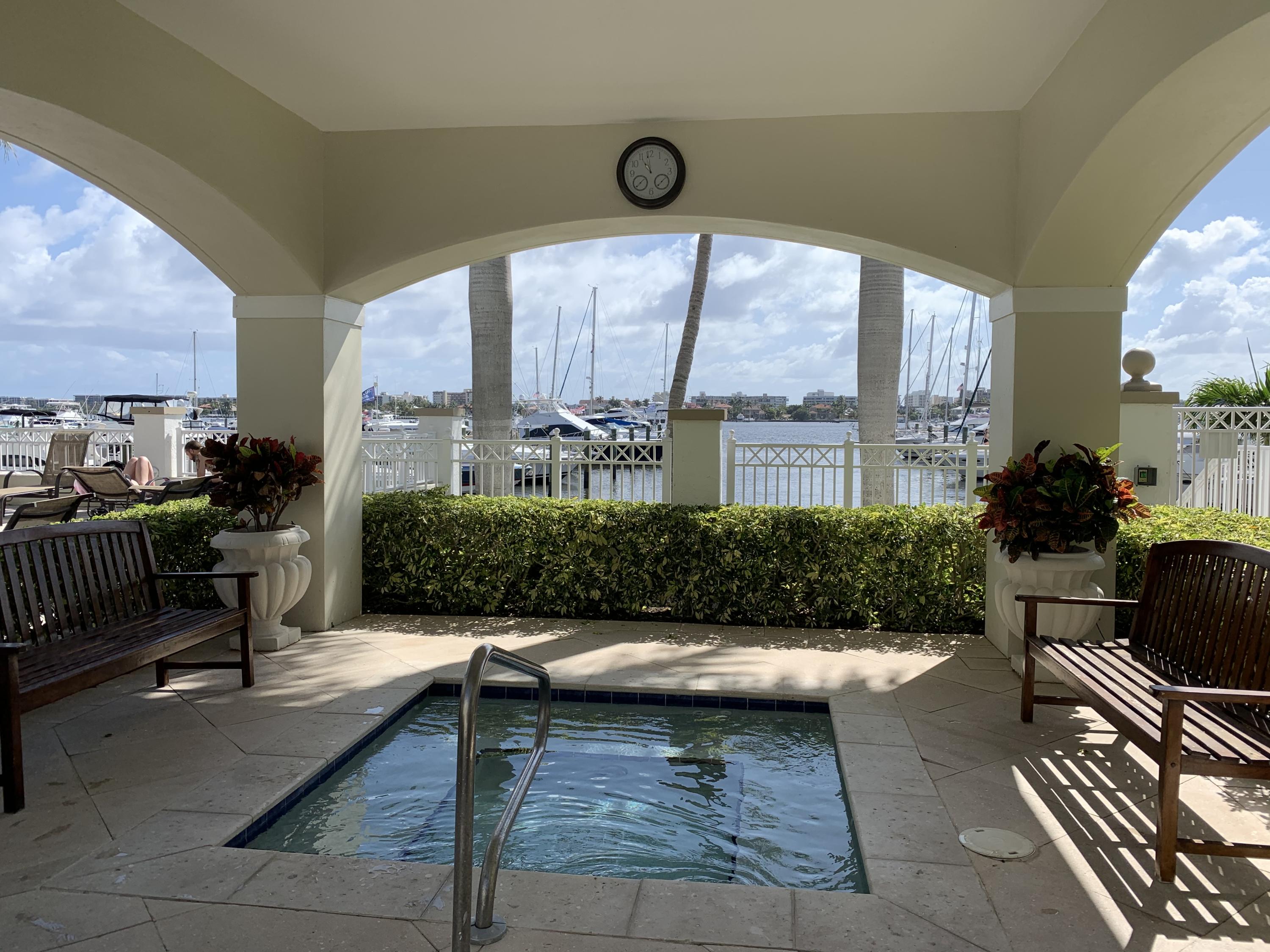 802 West Windward Way, Unit PH15 Lantana, FL 33462 - Photo 4 of 34 a living room with furniture and a floor to ceiling window