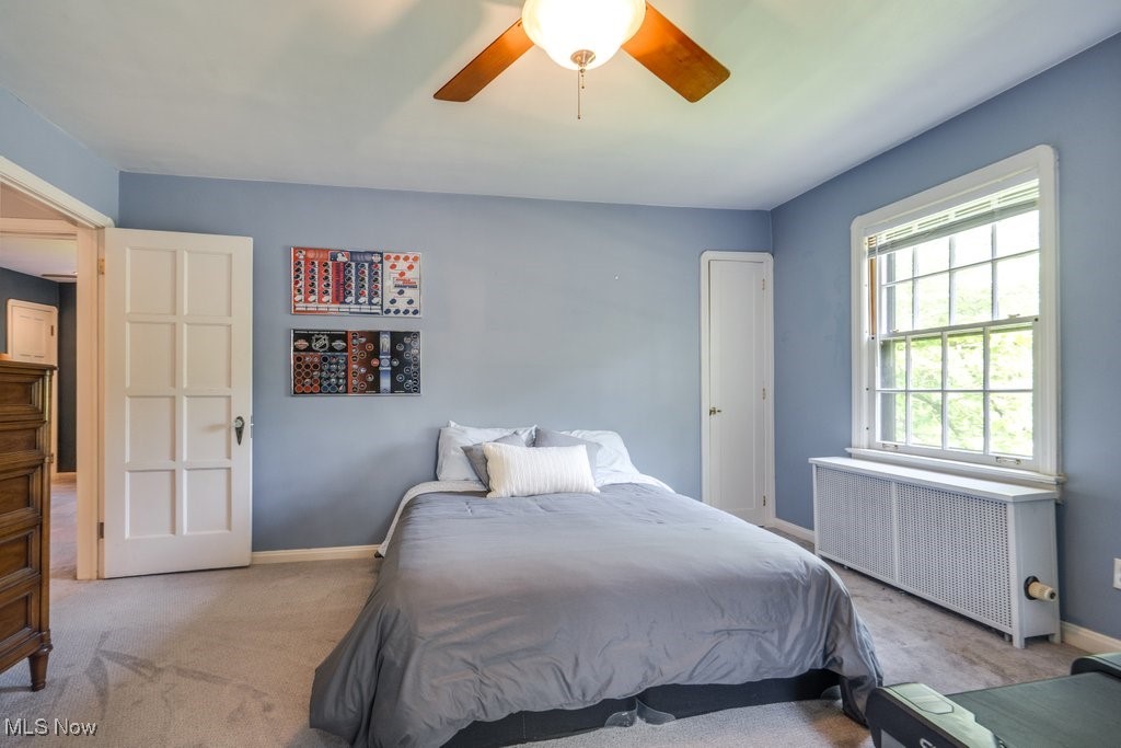 2500 Eaton Road Cleveland, OH 44118 - Photo 33 of 50 Bedroom with radiator heating unit, carpet floors, baseboards, and a ceiling fan