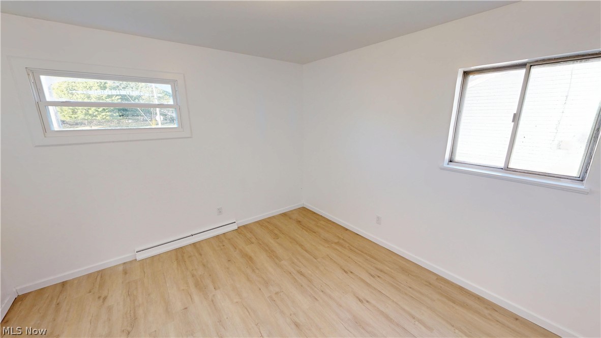 693 Liberty Road Youngstown, OH 44505 - Photo 10 of 14 Wood-finish flooring with white walls and dual windows