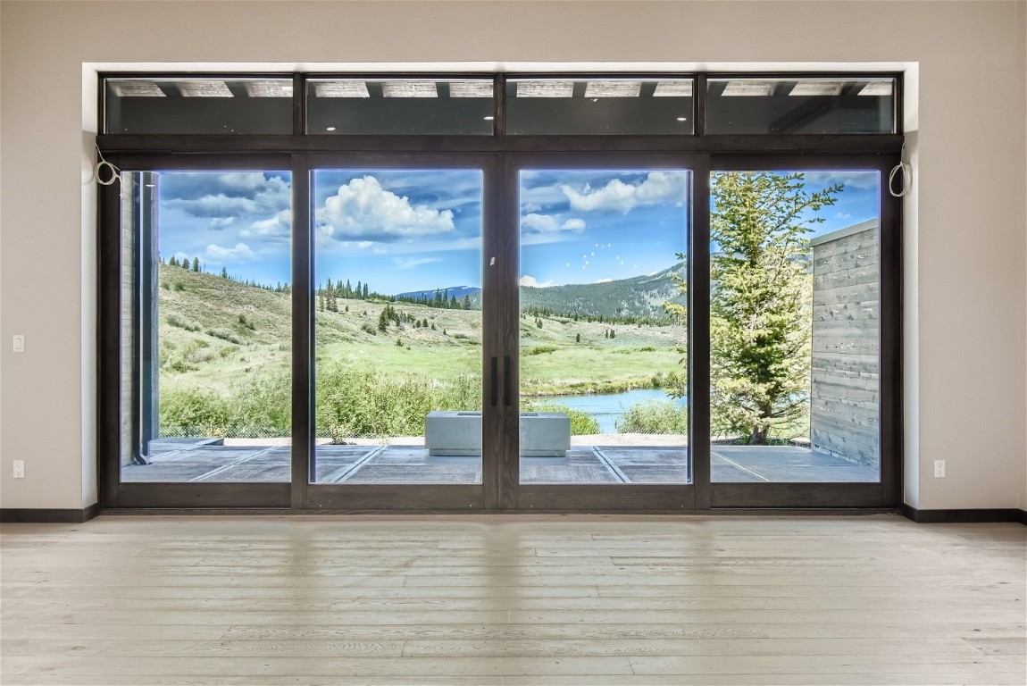 280 Monitor Drive Breckenridge, CO 80424 - Photo 16 of 50 Sliding Glass doors looking over the Blue River in recently completed home