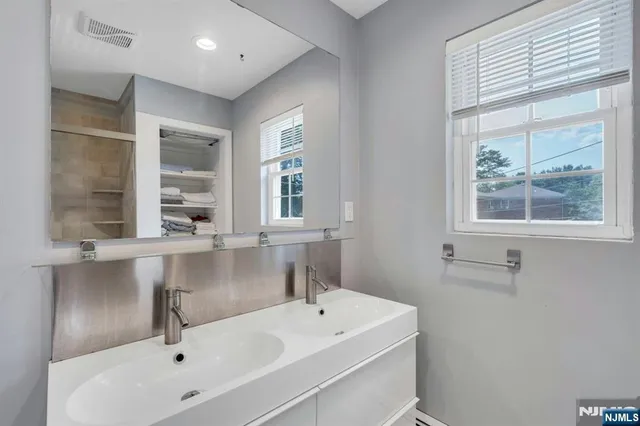 a bathroom with a sink and a bathtub