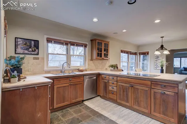 a kitchen with sink and cabinets
