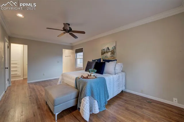 a bathroom with a granite countertop sink a large mirror and a window