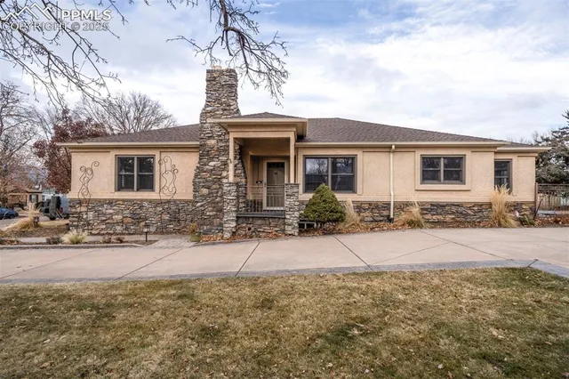 a view of a porch with furniture and wooden floor