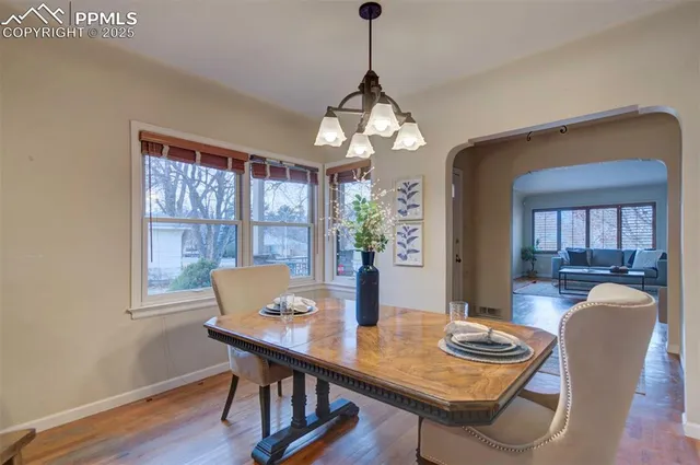 a view of a dining room with furniture window and wooden floor