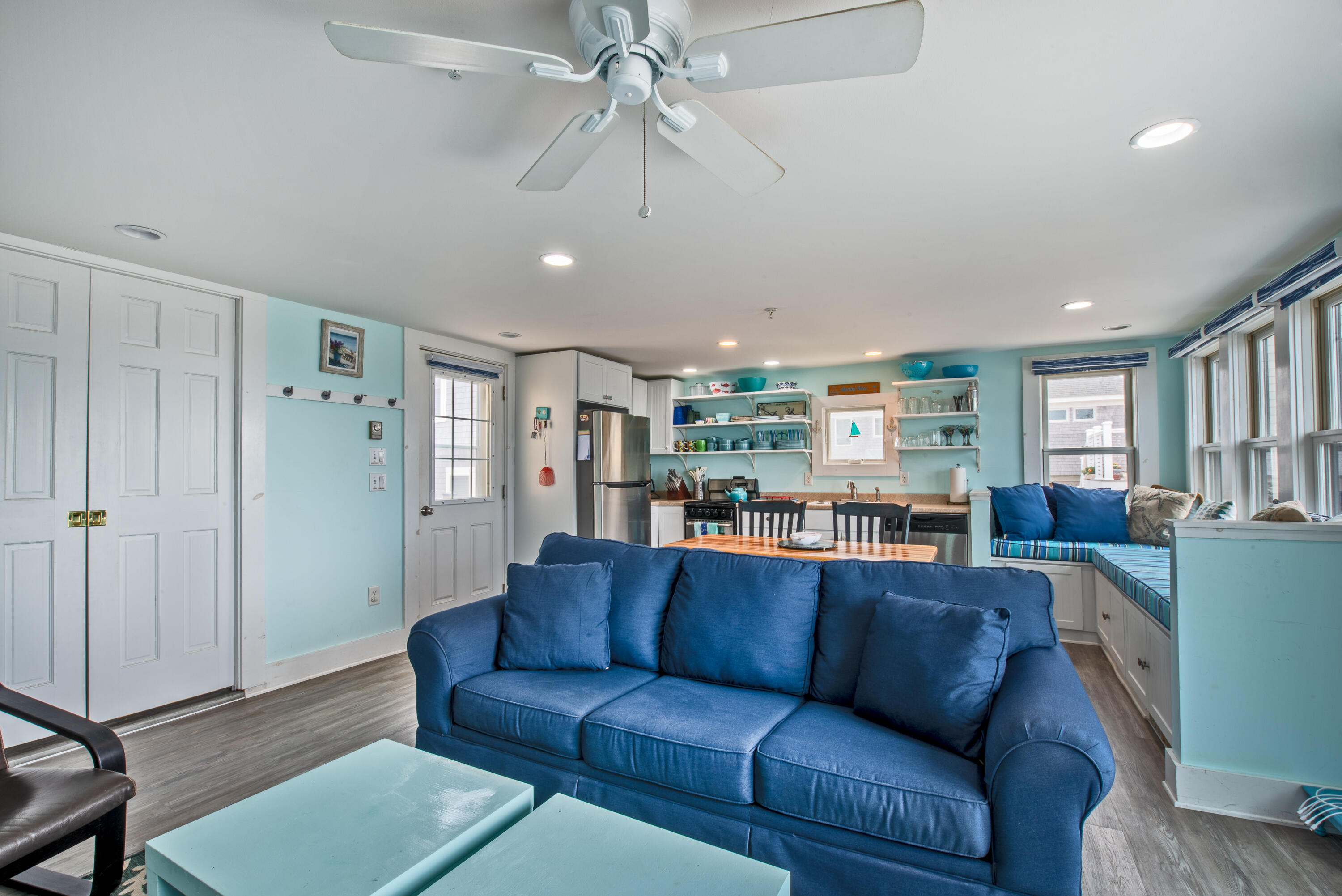 522 Shore Road, Unit 5 Truro, MA 02666 - Photo 12 of 28 a living room with furniture a ceiling fan and a window