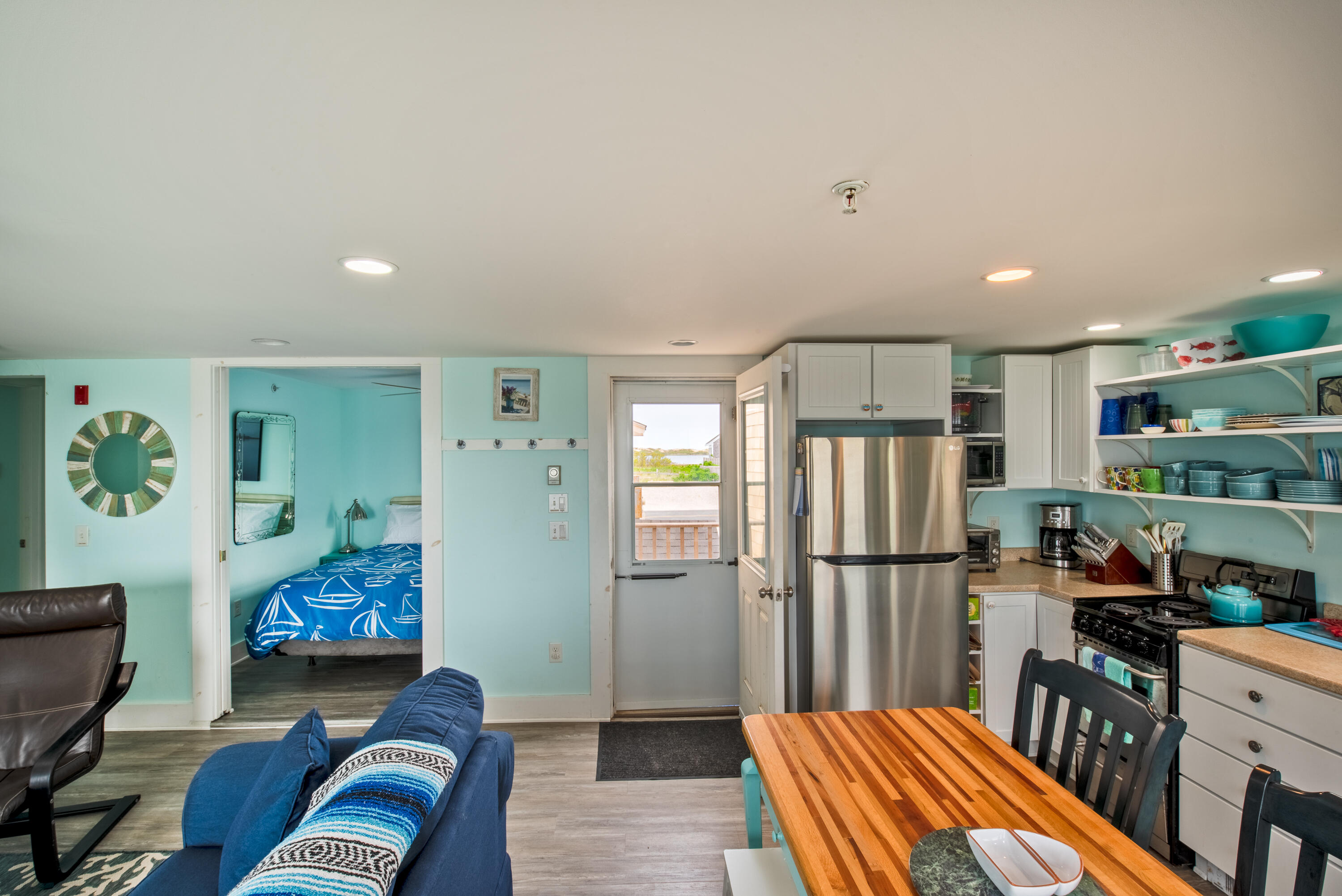 522 Shore Road, Unit 5 Truro, MA 02666 - Photo 15 of 28 a bedroom with furniture and a window