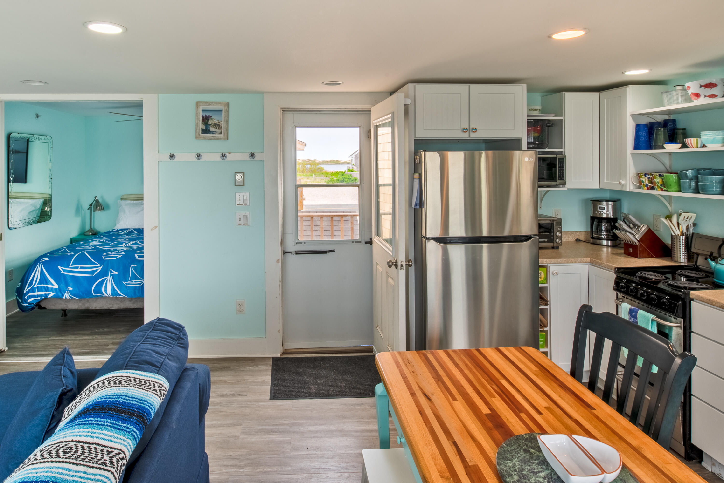 522 Shore Road, Unit 5 Truro, MA 02666 - Photo 16 of 28 a bedroom with furniture and a window