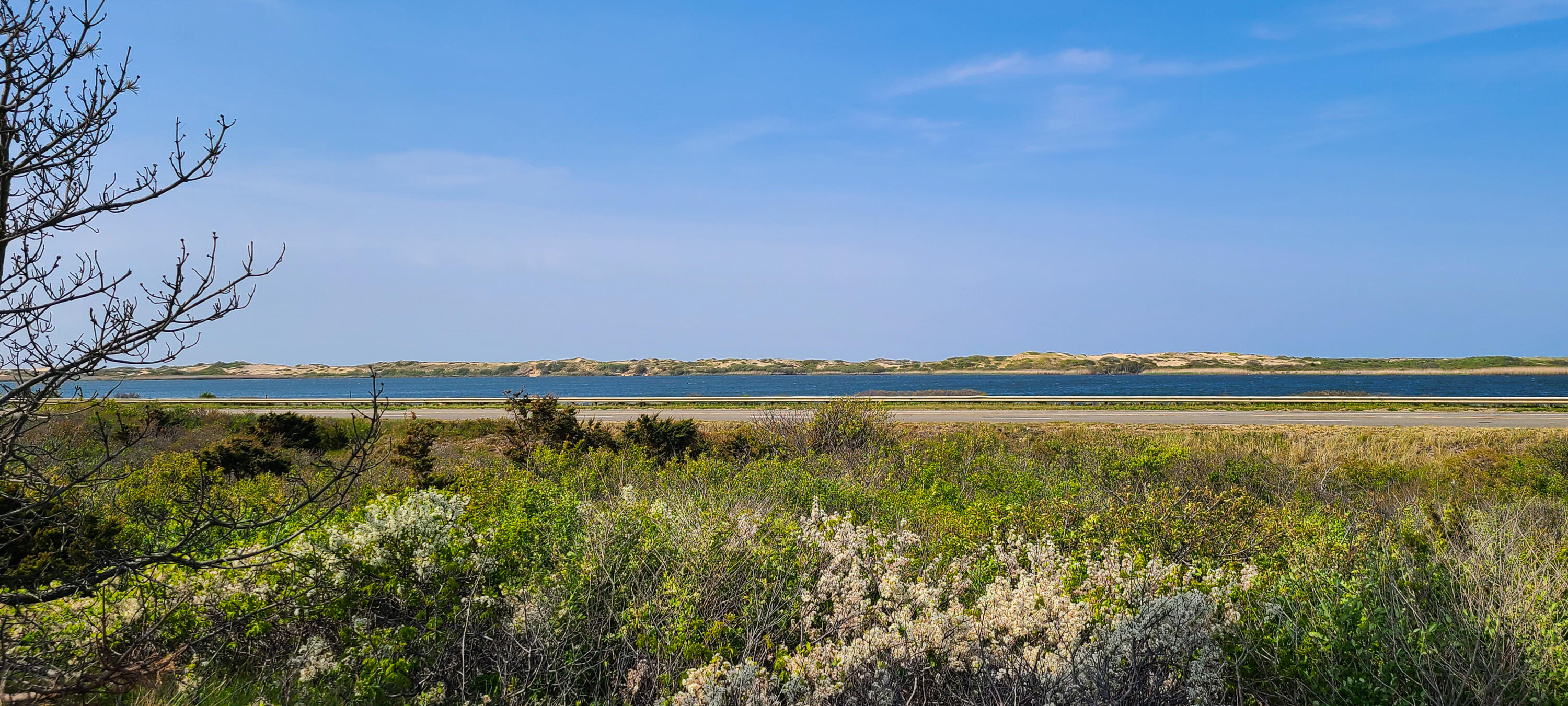 522 Shore Road, Unit 5 Truro, MA 02666 - Photo 24 of 28 a view of a lake with a mountain in the background