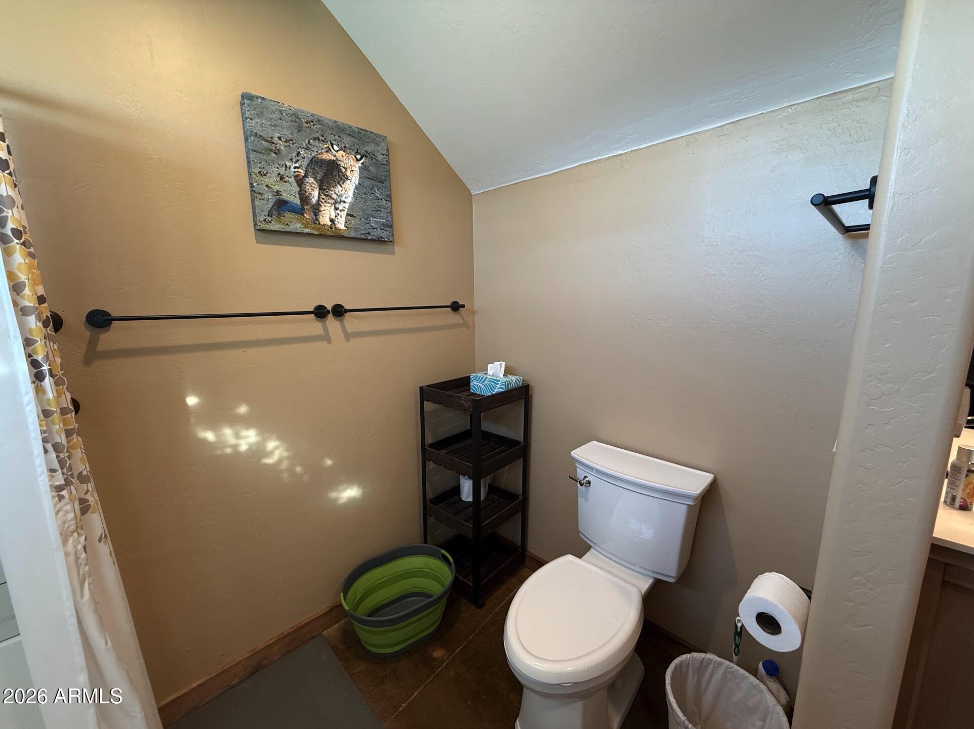 35723 South Amalia Road Eloy, AZ 85131 - Photo 11 of 34 a white toilet sitting next to a bathroom sink and a shower