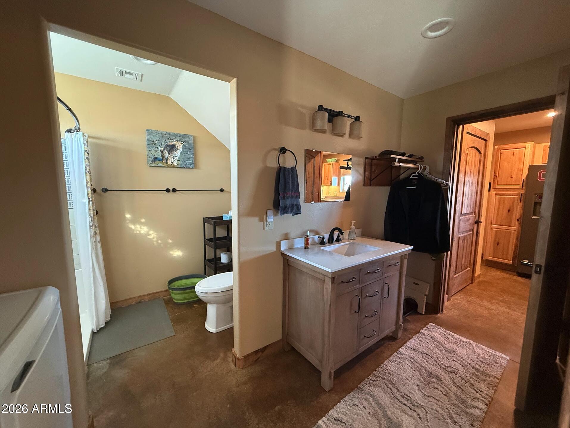 35723 South Amalia Road Eloy, AZ 85131 - Photo 12 of 34 a bathroom with a toilet sink and mirror