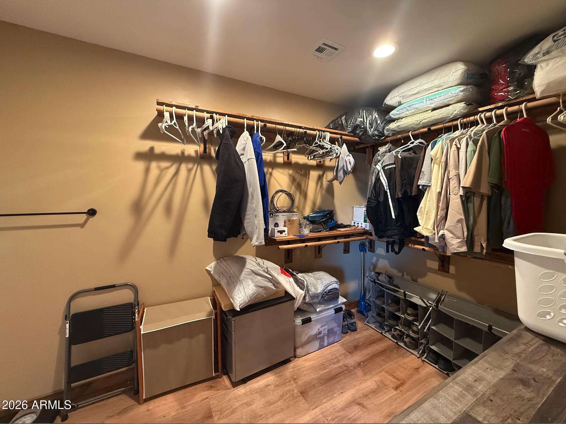 35723 South Amalia Road Eloy, AZ 85131 - Photo 20 of 34 a view of walk in closet with clothes and shoes