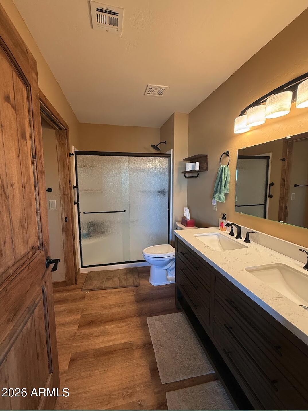 35723 South Amalia Road Eloy, AZ 85131 - Photo 22 of 34 a spacious bathroom with a double vanity sink toilet mirror and a shower