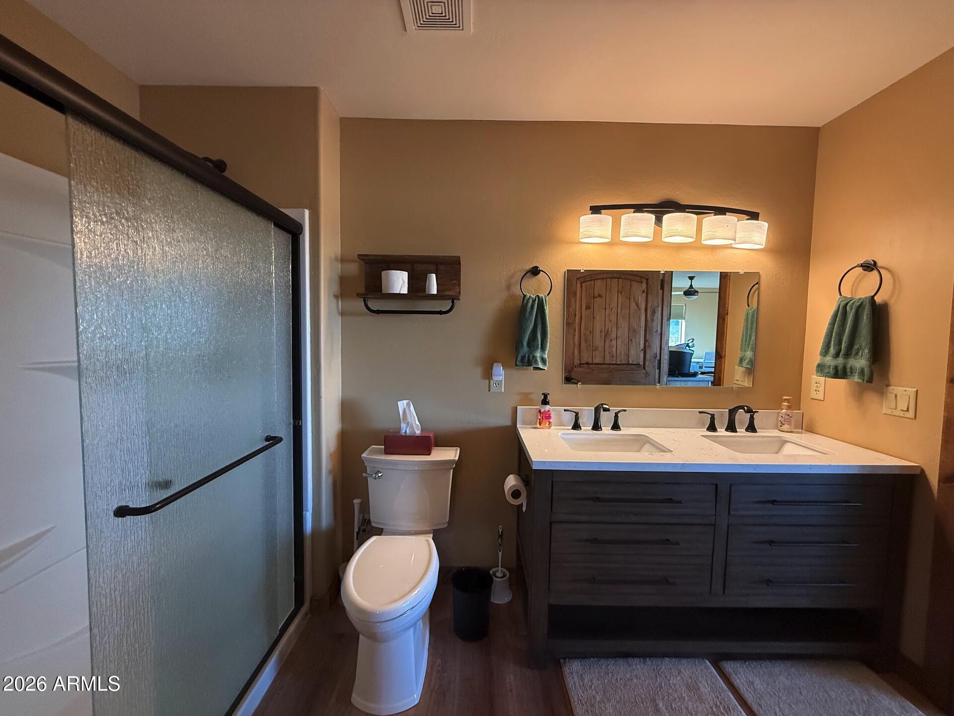 35723 South Amalia Road Eloy, AZ 85131 - Photo 23 of 34 a bathroom with a toilet sink and mirror