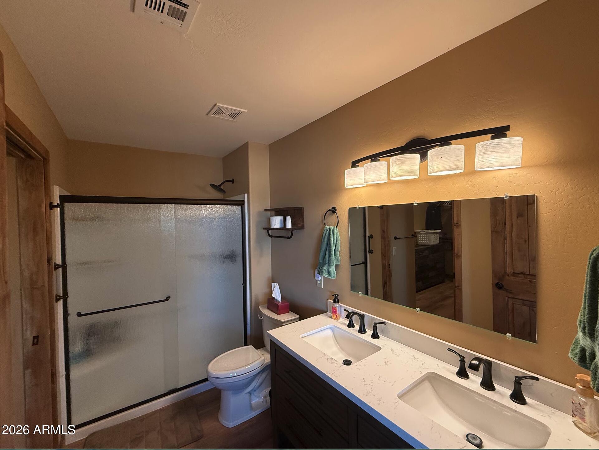 35723 South Amalia Road Eloy, AZ 85131 - Photo 24 of 34 a bathroom with a sink toilet and shower