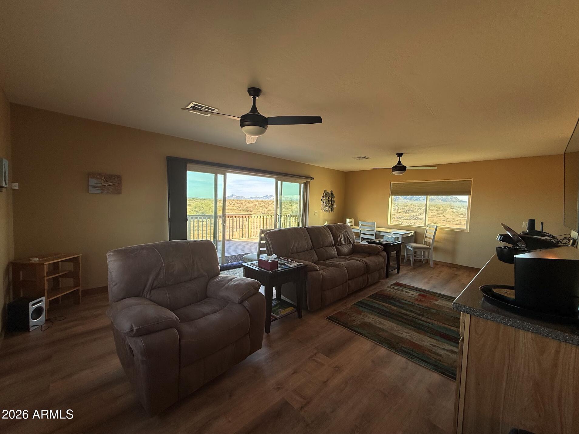 35723 South Amalia Road Eloy, AZ 85131 - Photo 27 of 34 a living room with furniture a ceiling fan and a window