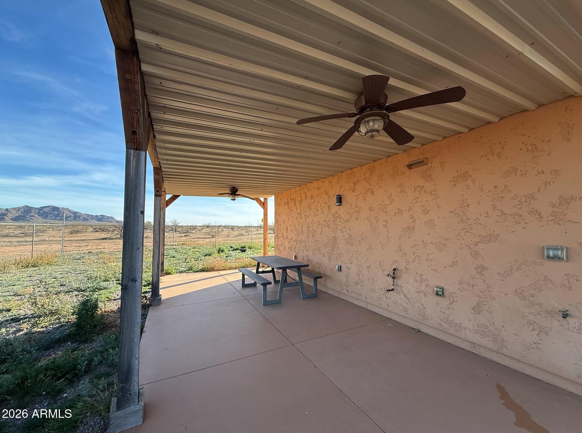 35723 South Amalia Road Eloy, AZ 85131 - Photo 29 of 34 a view of a patio with a table and chairs under an umbrella
