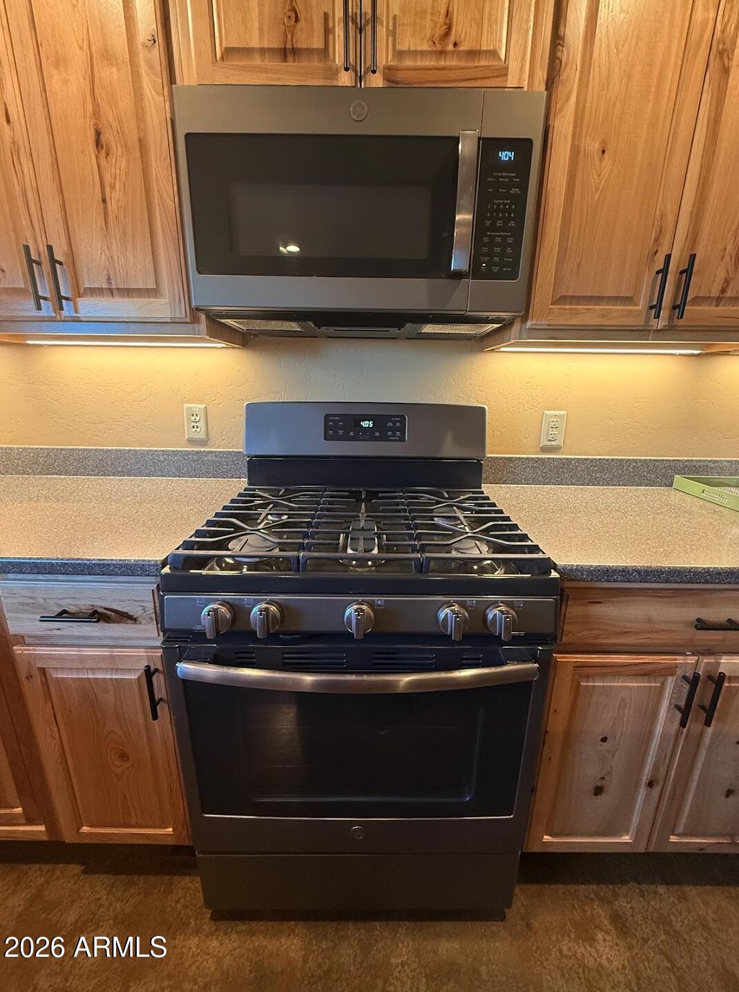 35723 South Amalia Road Eloy, AZ 85131 - Photo 8 of 34 a stove top oven sitting inside of a kitchen