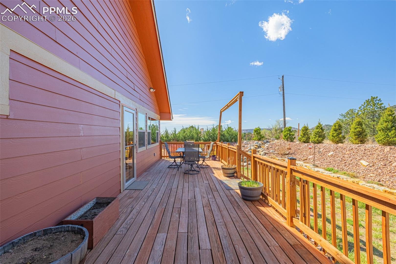 8480 Delaware Road Colorado Springs, CO 80926 - Photo 29 of 50 Wooden terrace featuring outdoor dining space