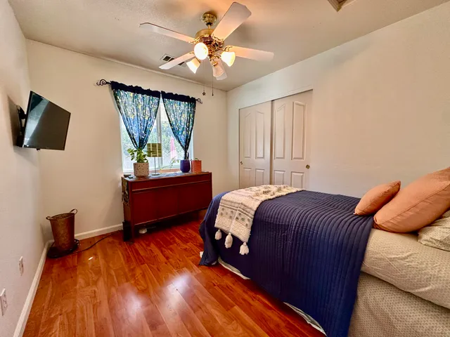 a bedroom with a bed and window