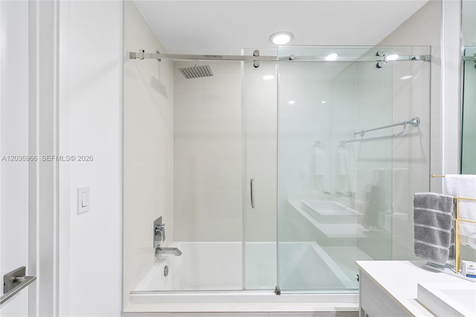 55 Southwest 9th Street, Unit 1904 Miami, FL 33130 - Photo 44 of 66 a bathroom with a bathtub and a shower