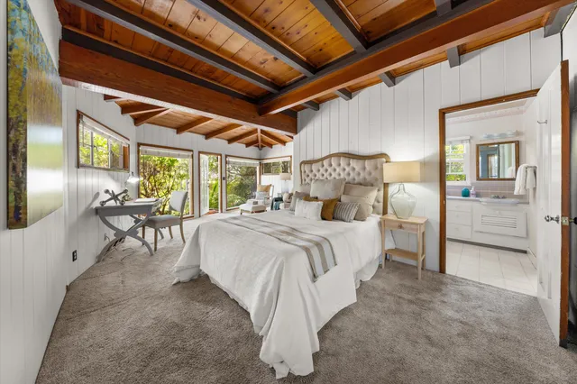 a aerial view of a house with swimming pool and a yard