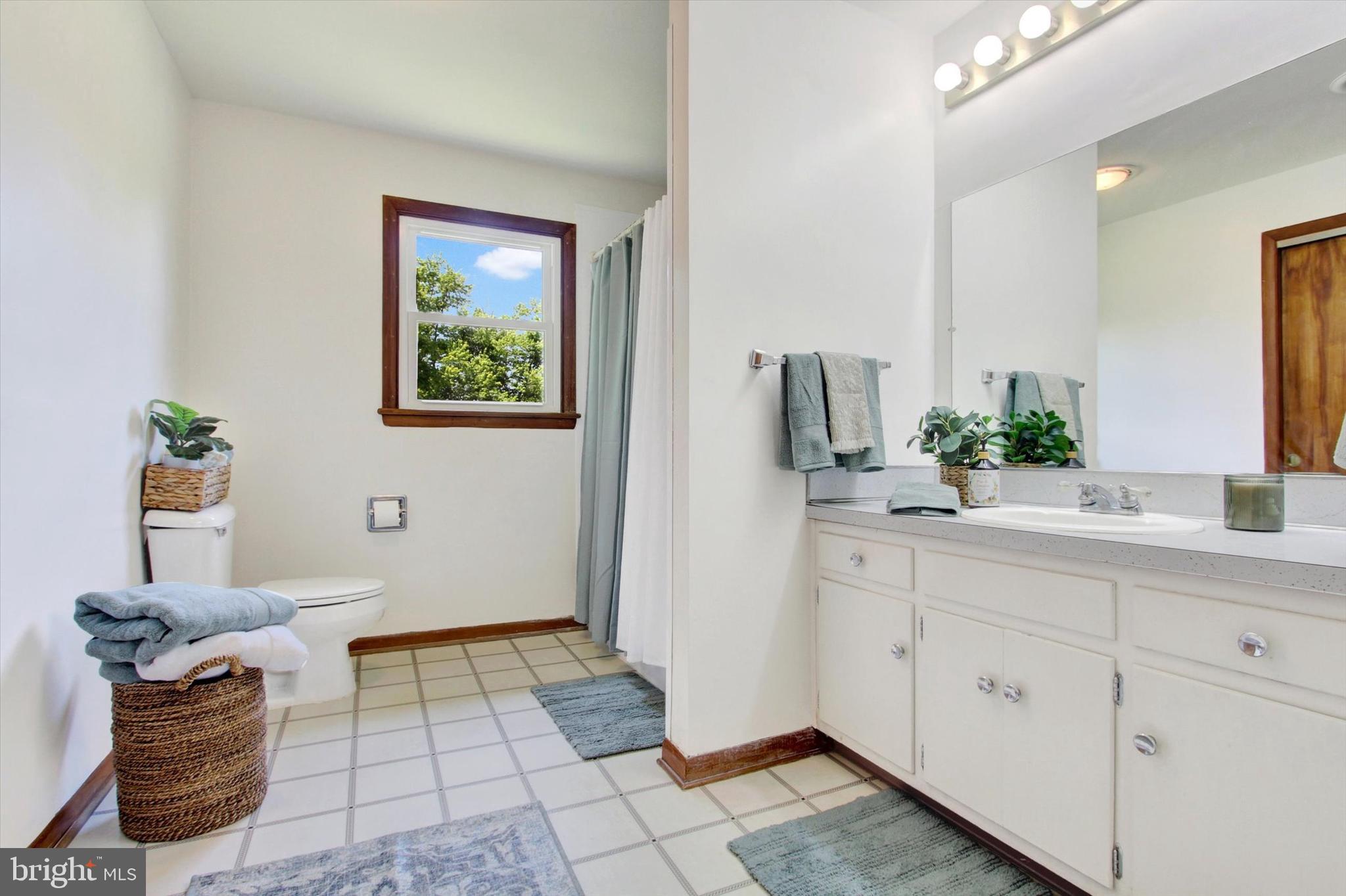 3231 Taneytown Road Gettysburg, PA 17325 - Photo 21 of 36 a bathroom with a sink and a mirror