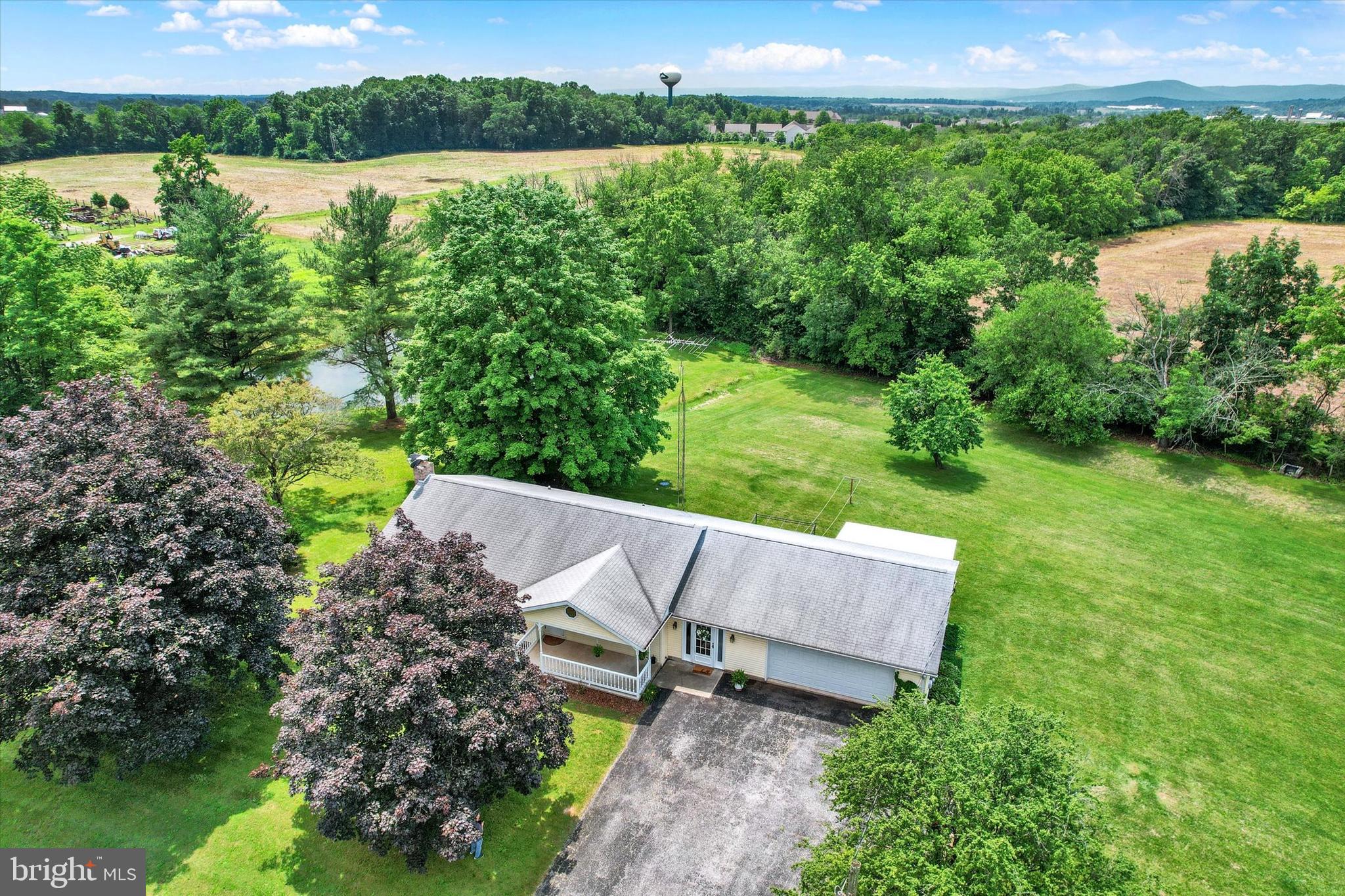 3231 Taneytown Road Gettysburg, PA 17325 - Photo 32 of 36 an aerial view of a house with a yard and lake view
