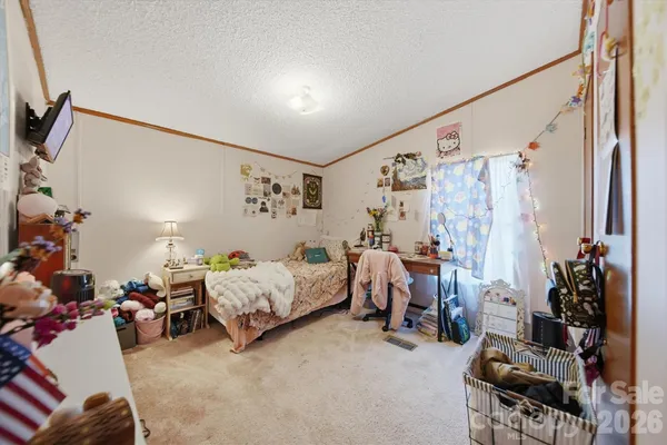 a bed room with furniture and a window