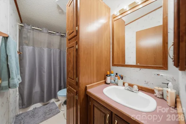 a bathroom with a sink double vanity and a mirror
