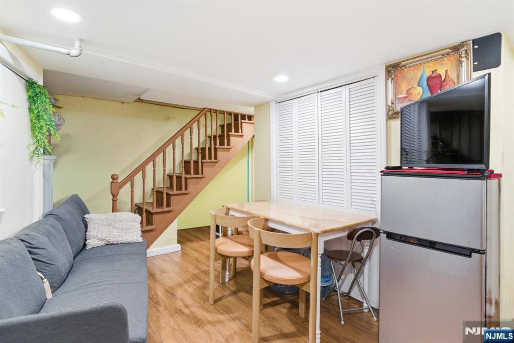 61 Cutler Street Newark, NJ 07104 - Photo 2 of 22 a living room with furniture and a flat screen tv