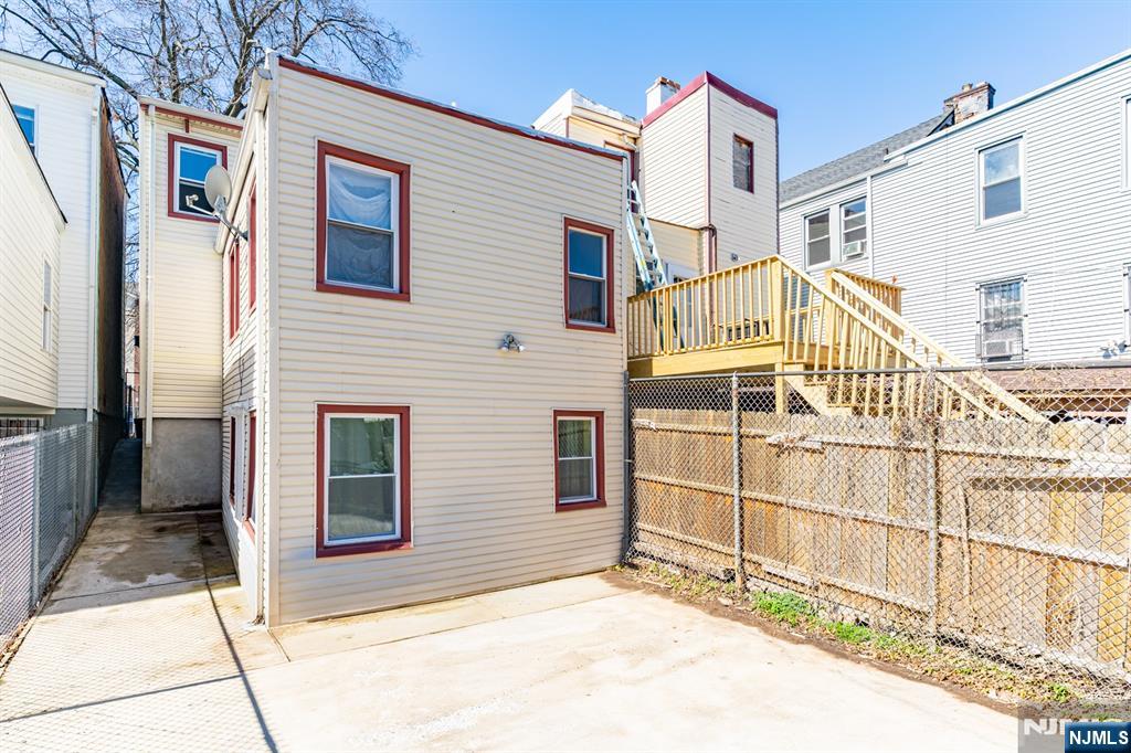 61 Cutler Street Newark, NJ 07104 - Photo 21 of 22 a view of a house with a backyard