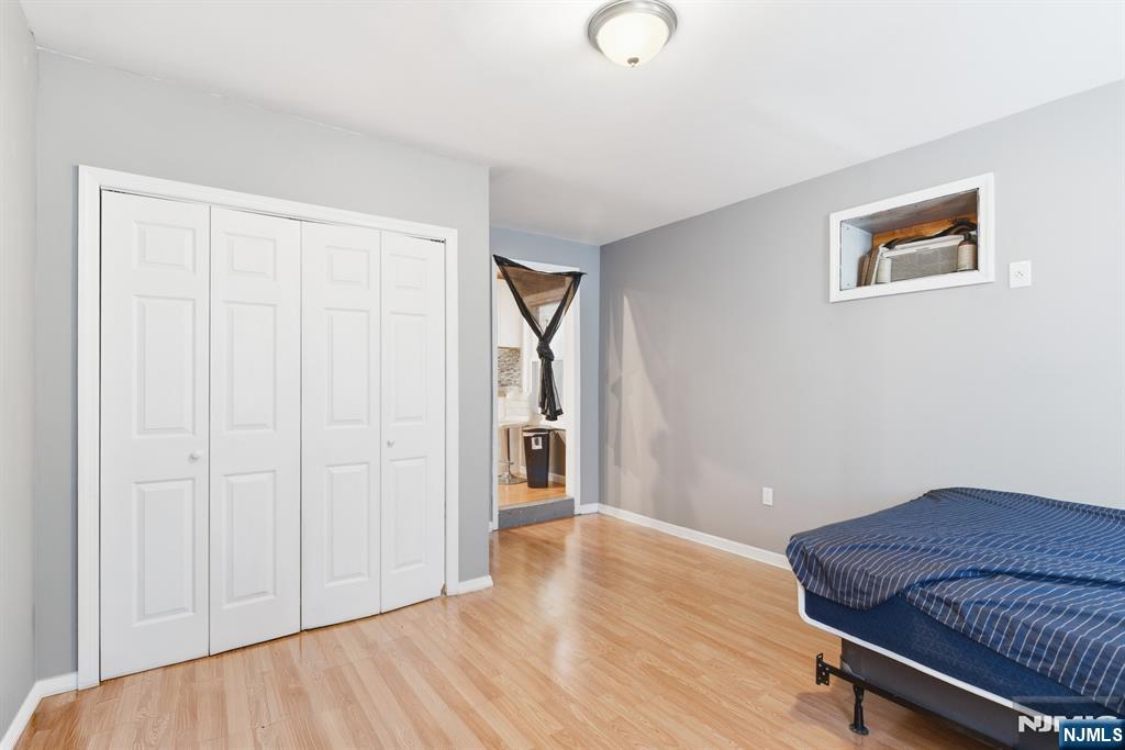 61 Cutler Street Newark, NJ 07104 - Photo 9 of 22 a view of a room with wooden floor and bathroom