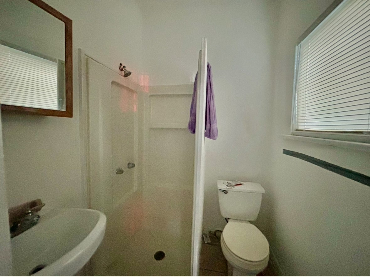 6124 Goforth Street Houston, TX 77021 - Photo 12 of 21 a bathroom with a toilet and a shower