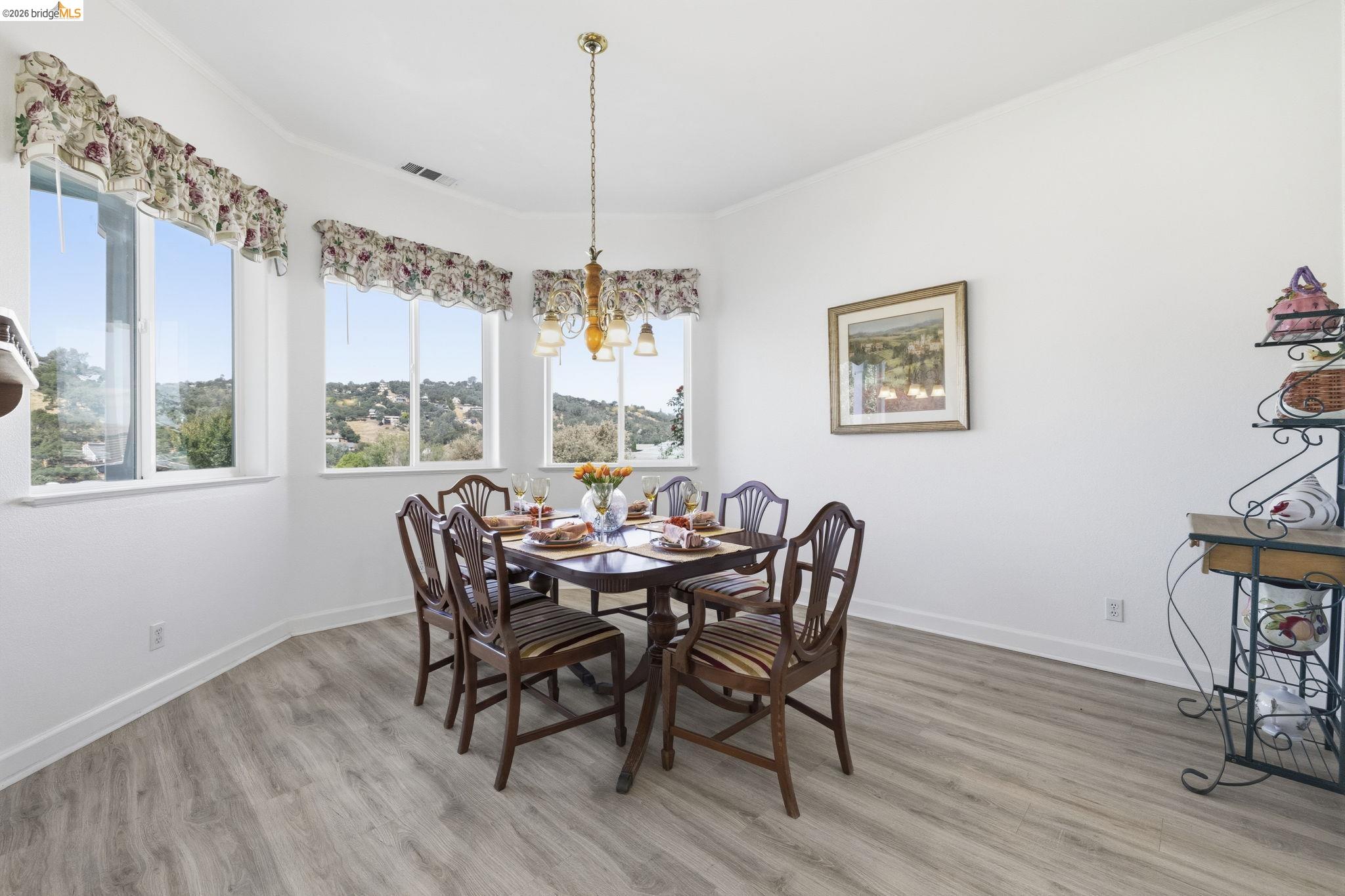 6242 Bluff View Road Copperopolis, CA 95228 - Photo 15 of 59 Dining area featuring a bay window to take in the views of the lake and hills