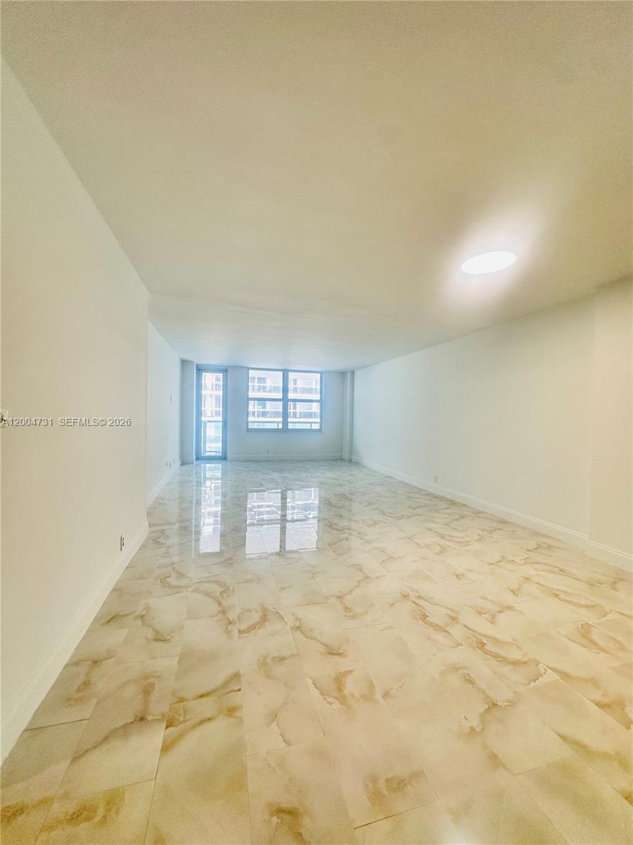 9511 Collins Avenue, Unit 1001 Surfside, FL 33154 - Photo 12 of 34 a view of an empty room