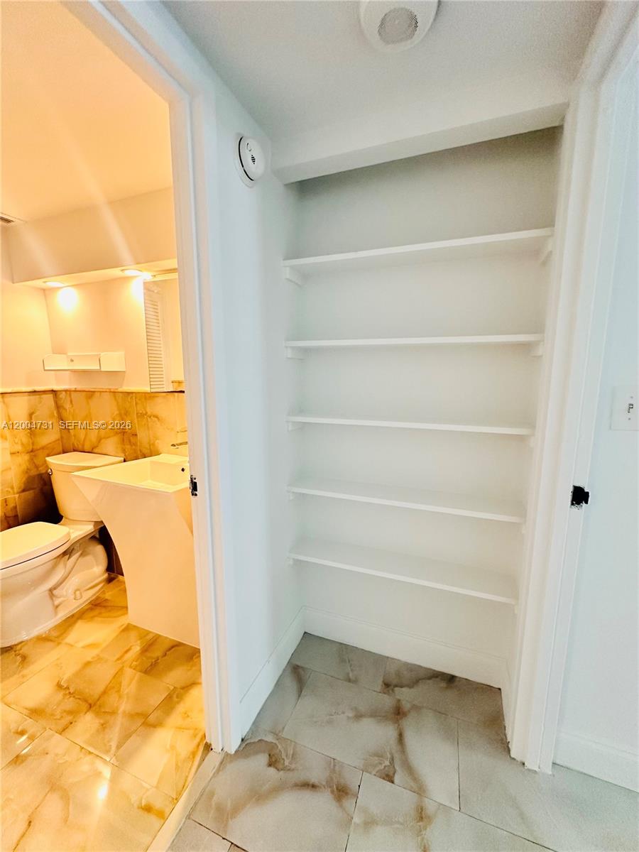 9511 Collins Avenue, Unit 1001 Surfside, FL 33154 - Photo 17 of 34 a view of walk in closet