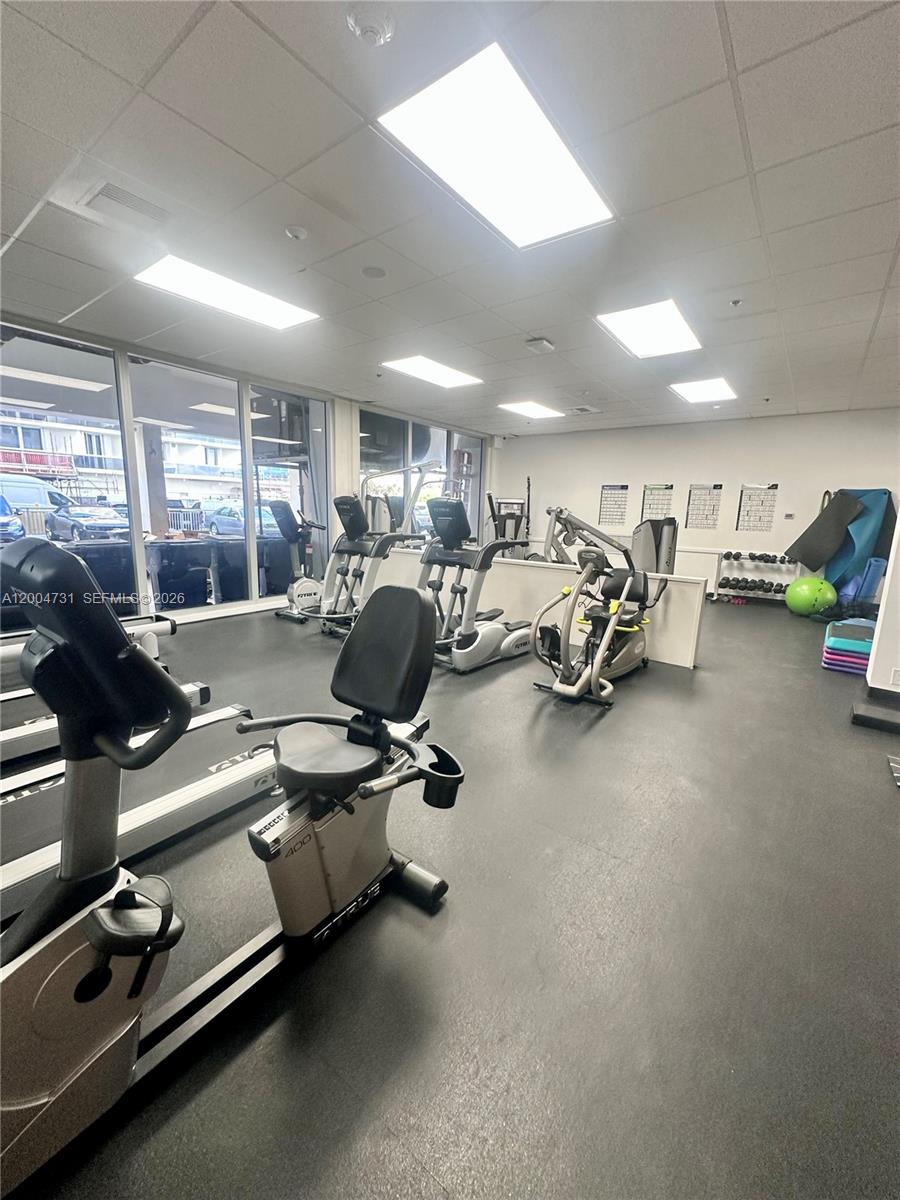 9511 Collins Avenue, Unit 1001 Surfside, FL 33154 - Photo 26 of 34 a view of a room with gym equipment