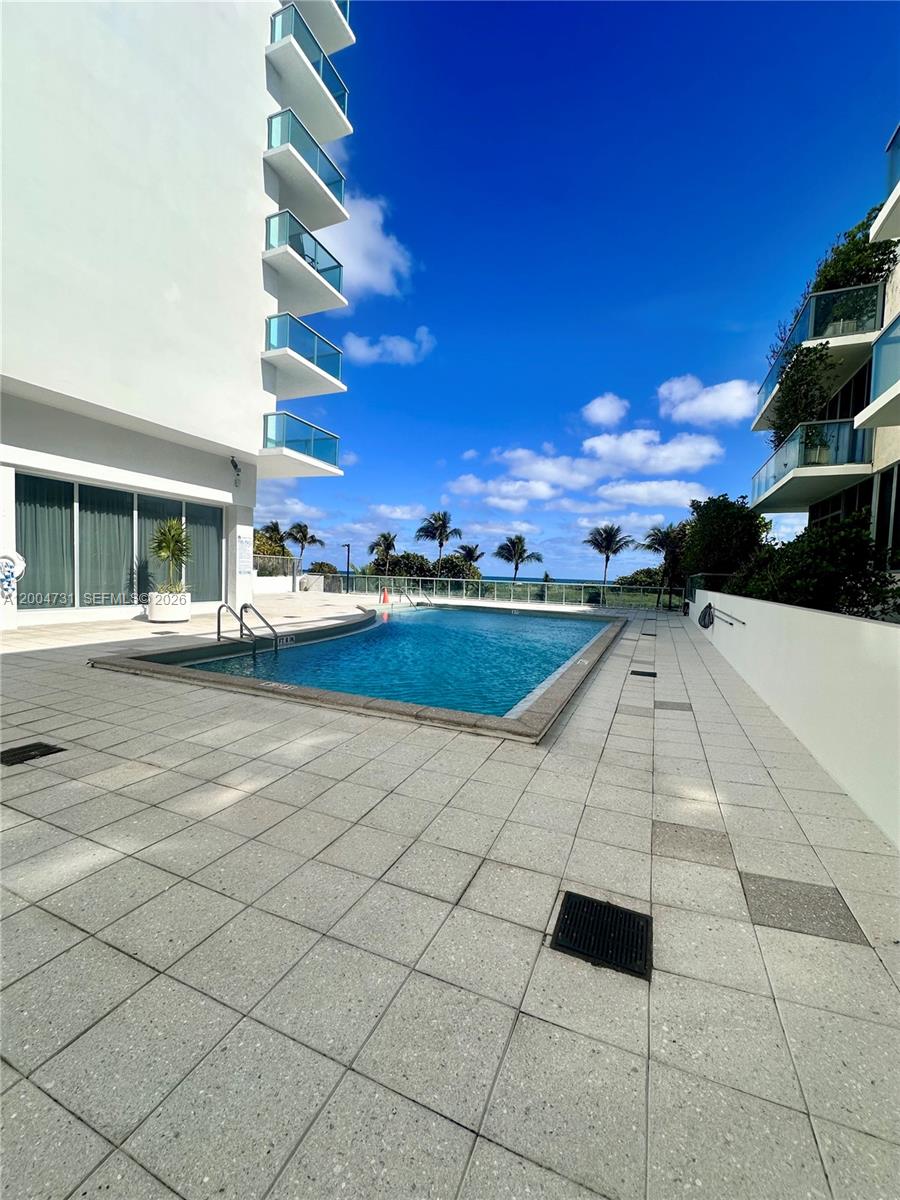 9511 Collins Avenue, Unit 1001 Surfside, FL 33154 - Photo 27 of 34 a view of a terrace with sky view